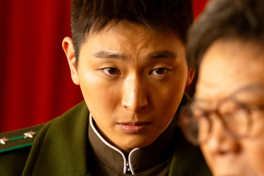 2AM’s Jeong Jinwoon Exudes Cold Charisma As A North Korean Captain In New Film “Choir Of God”
